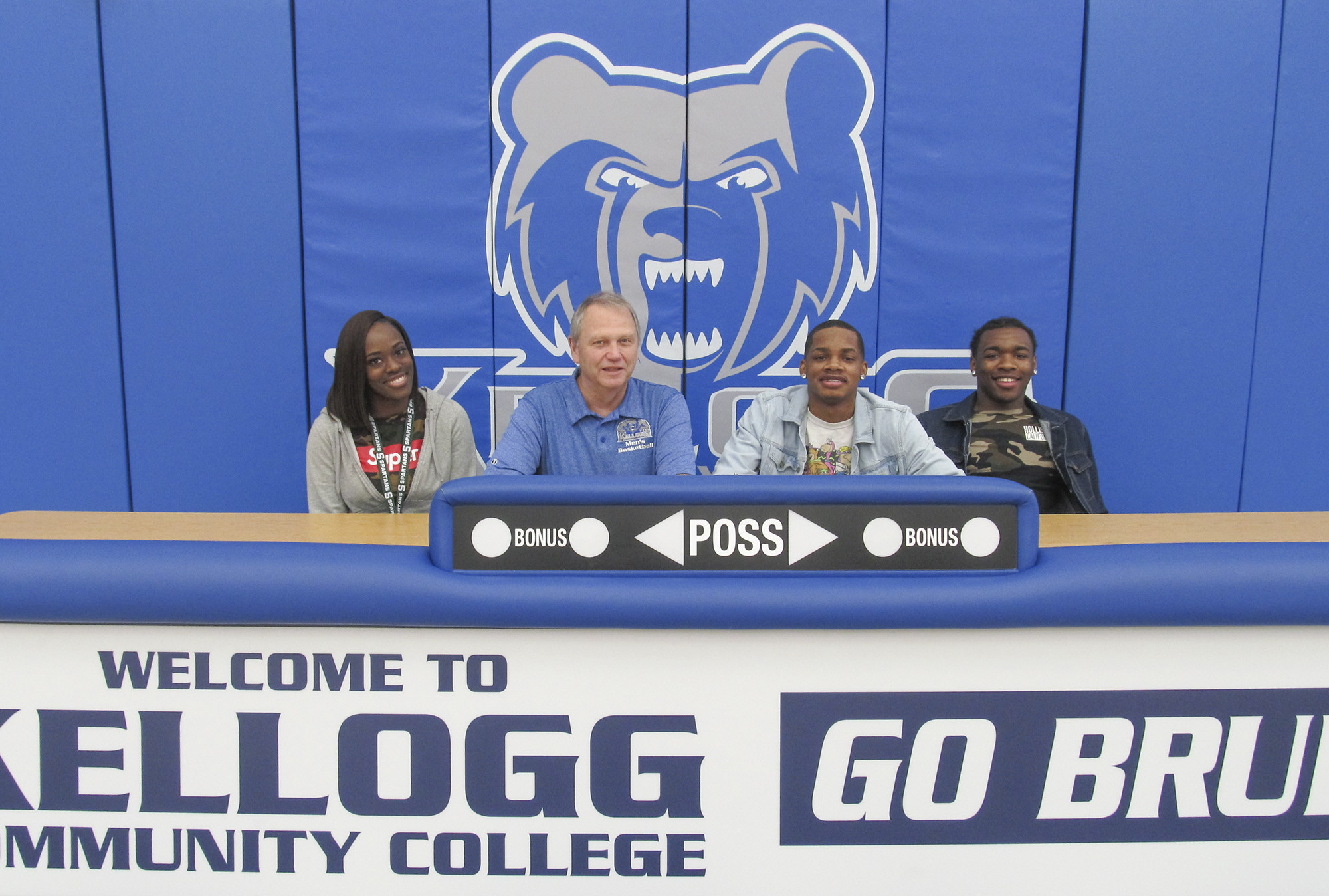 Pictured, from left to right, are Micah Mcree-Davis (cousin), KCC’s Head Men’s Basketball Coach Gary Sprague, Karlos Berry and Tavion Kelley (brother).
