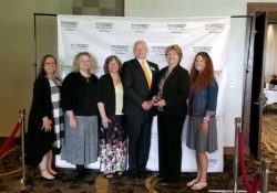 Dr. Keck poses with KCC staff after accepting the 2019 Distinguished Woman in Higher Education Leadership Award from the Michigan ACE Women’s Network.