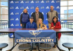 In the front row, from left to right, are Ken Sult (father), Lizzie Sult and Cindy Andrews (mother). In the back row, from left to right, are Head KCC Cross-Country Coach Erin Lane, Eric Andrews (stepfather) and Harper Creek High School’s Head Cross-Country Coach Ryan Renner.
