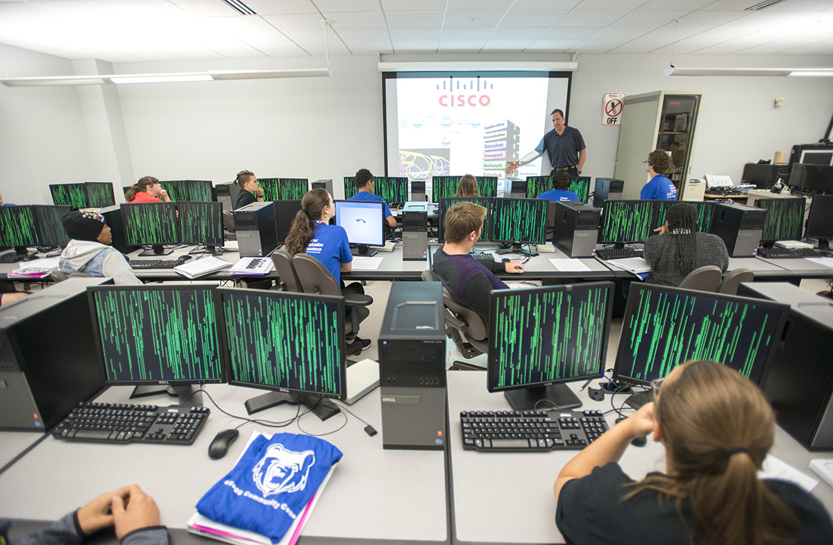 Students listen to an instructor in a KCC computer lab.