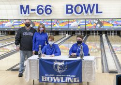 Pictured, from left to right, are Zach Beard (father), Cheryl Beard (mother), Cody Beard and Head KCC Bowling Coach Brad Morgan.