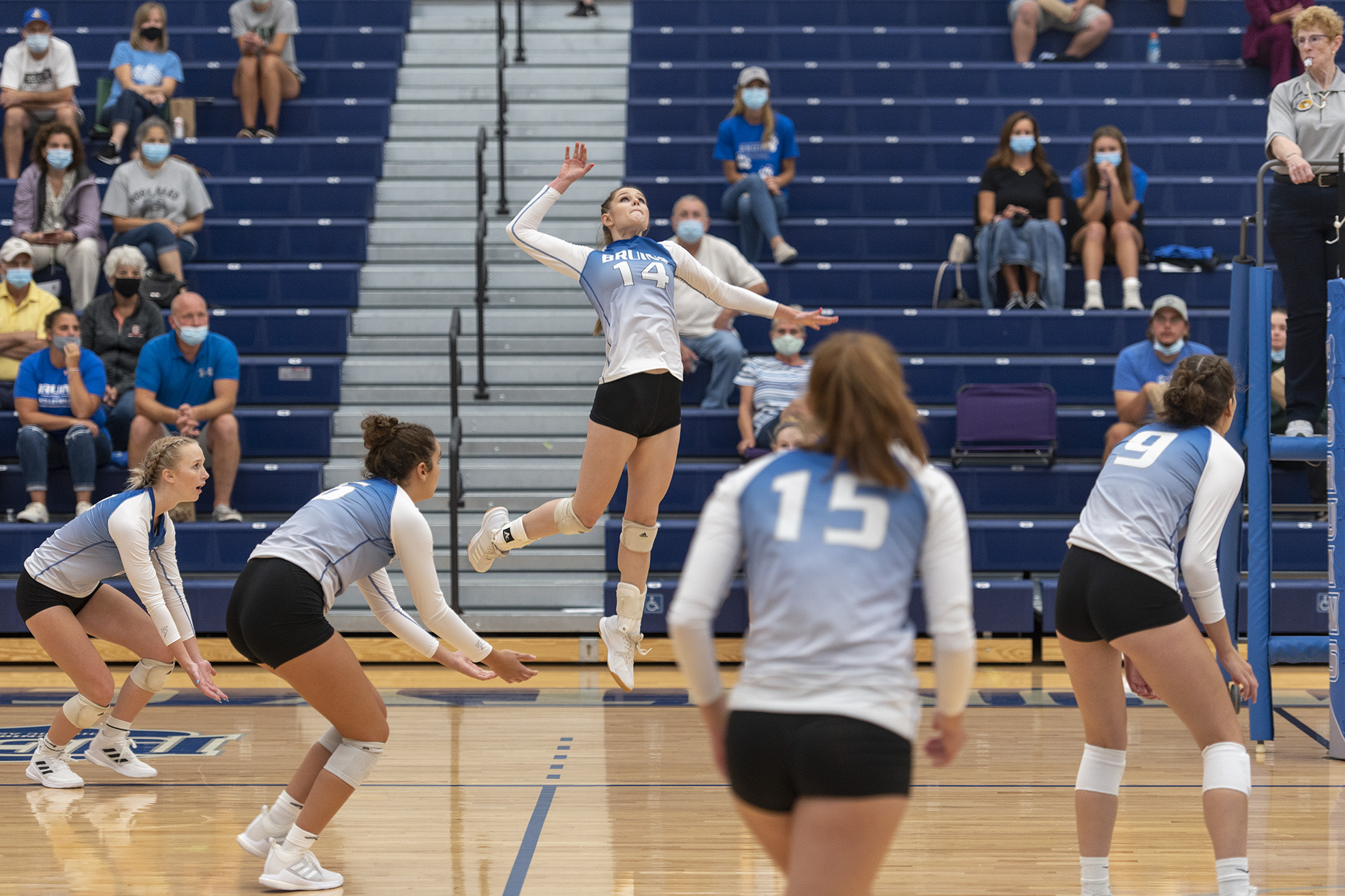 KCC's women's volleyball team competes during a match at home.