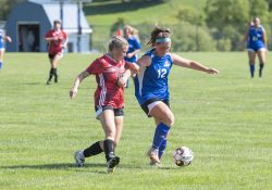 Women's soccer player Chloe Leugers competes during a game.