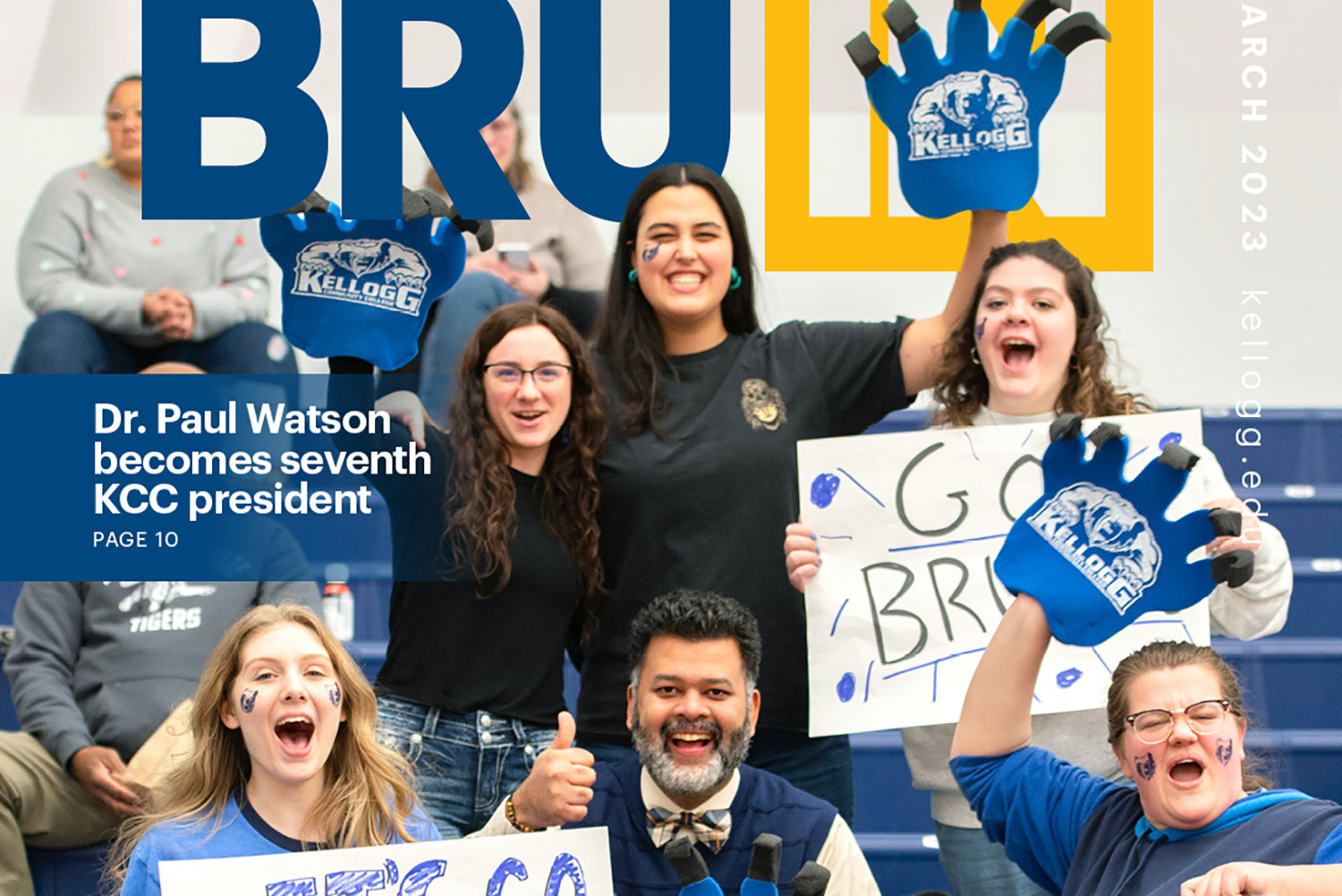A crop of the March 2023 BruIN magazine cover showing fans cheering in the gym stands.