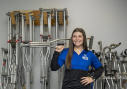 PTA student Chloe Leugers poses with crutches in the PTA Lab.
