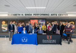KCC and Davenport officials pose for a large group photo after an articulation agreement signing.