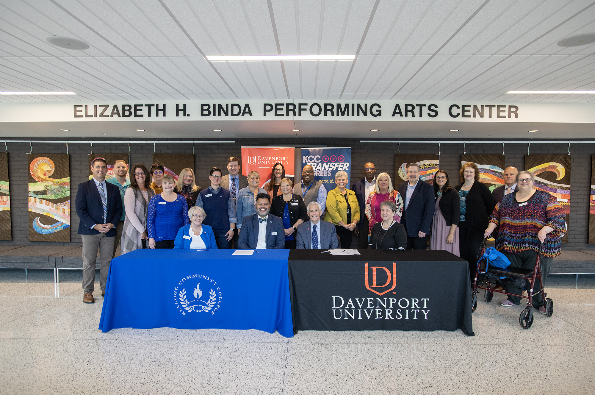 KCC and Davenport officials pose for a large group photo after an articulation agreement signing.