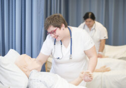 CNA students train using manikins in a CNA Lab on campus.