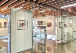 An art exhibit hangs in the campus gallery.
