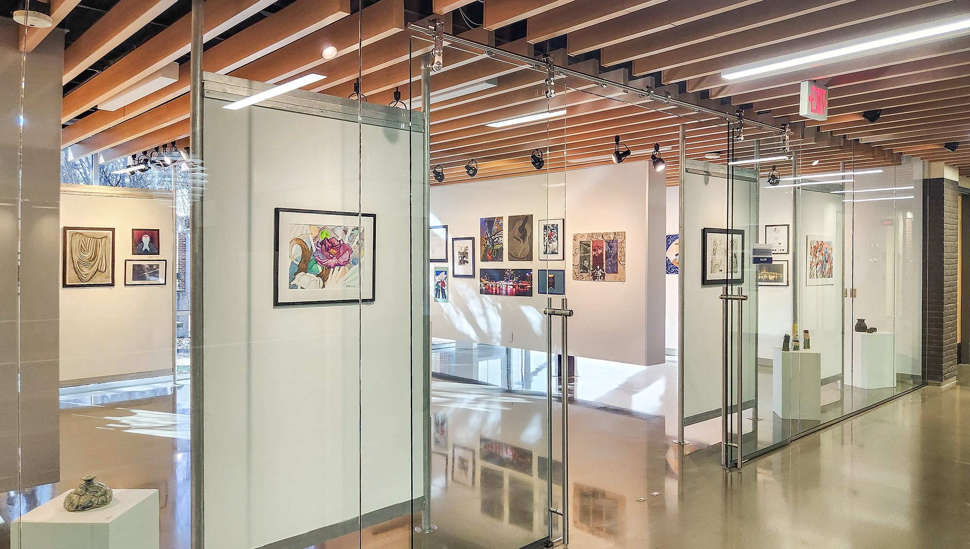 An art exhibit hangs in the campus gallery.