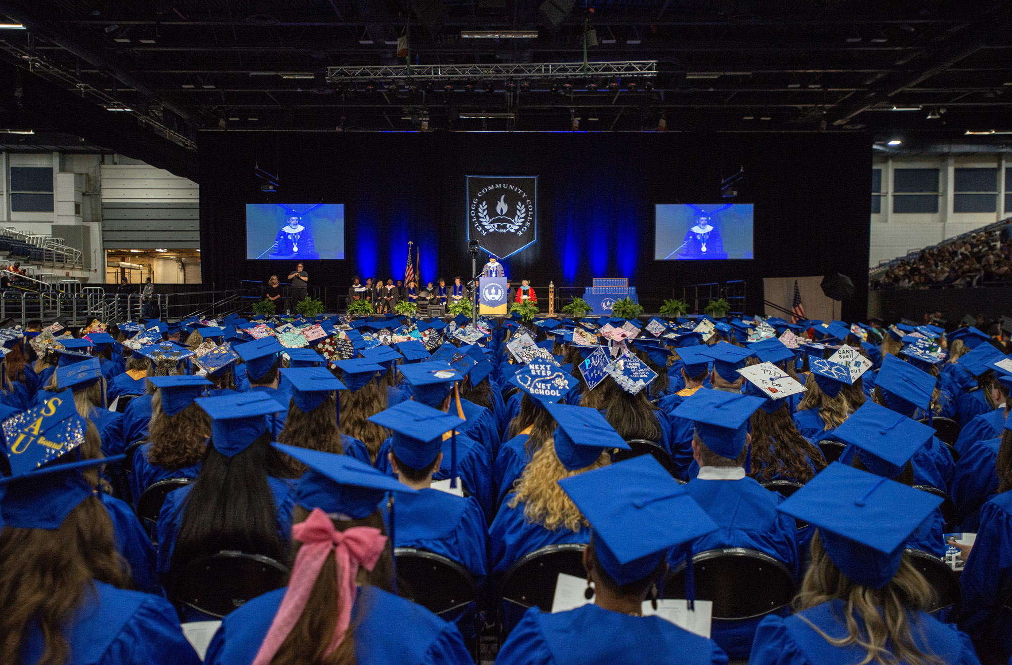 Graduates seated before the stage at Commencement.