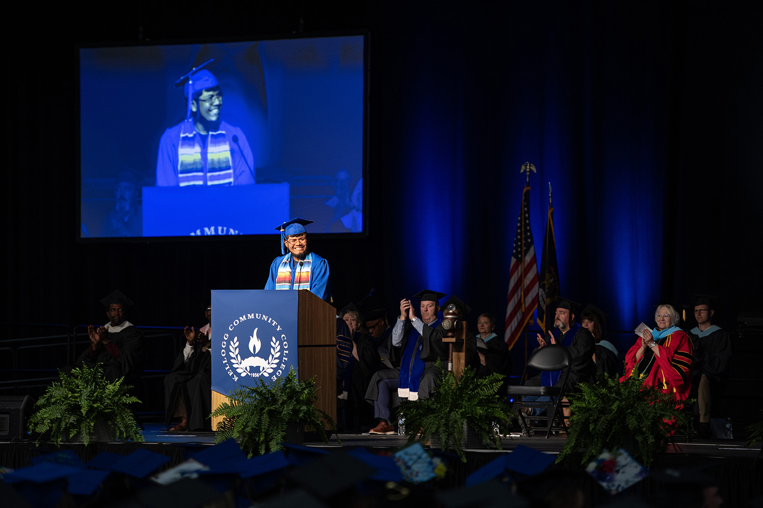 Commencement speaker Angel speaks to graduates from the stage at Commencement.