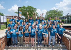 A large group photo of Gold Key and Board of Trustee scholarship recipients pictured outside on campus.