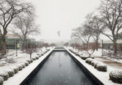 A view looking over the reflecting pools on campus on a snowy winter day.