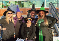 Take-A-Break Child Care Center representatives dressed in Halloween costumes at Bruin Boo.