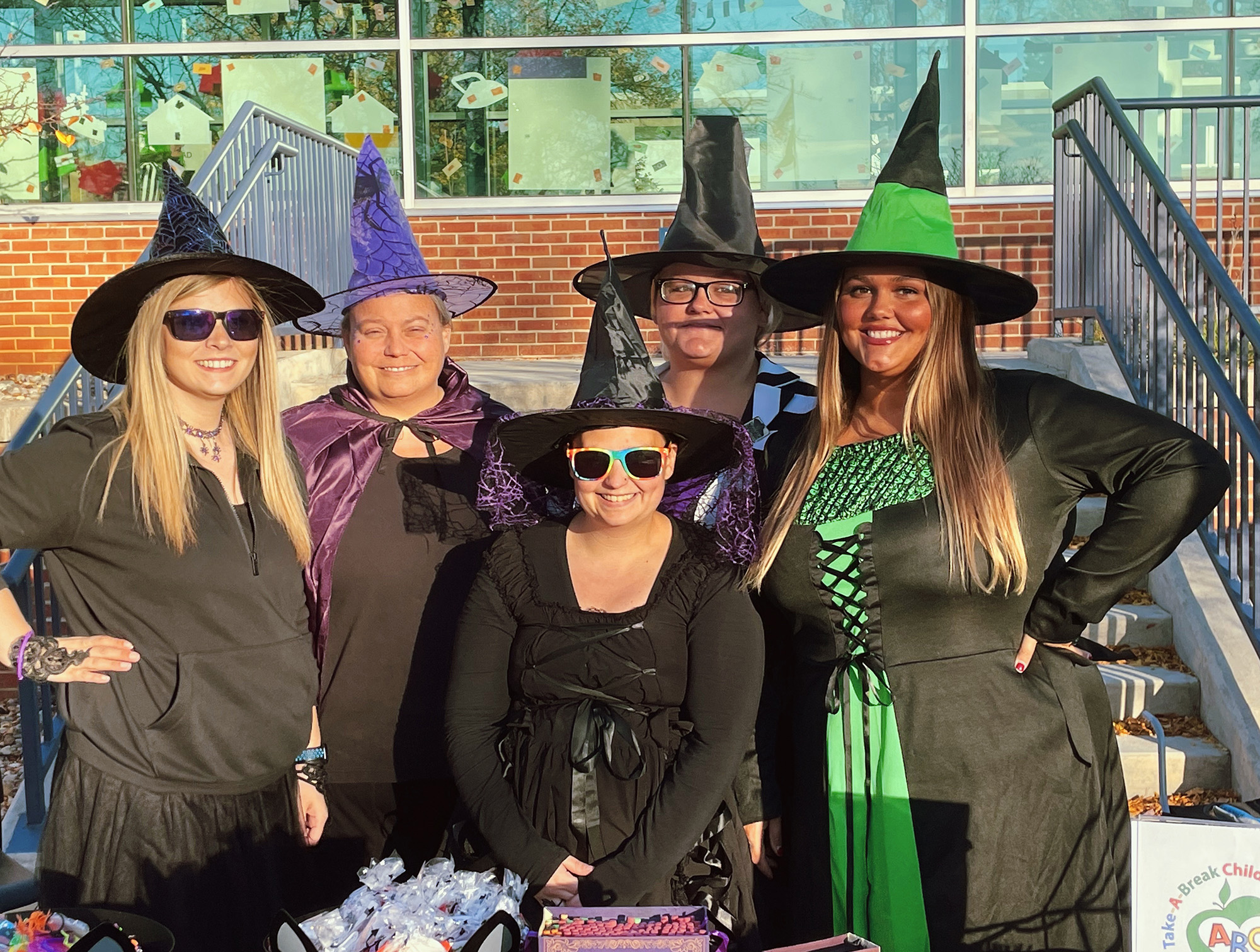 Take-A-Break Child Care Center representatives dressed in Halloween costumes at Bruin Boo.