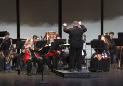 The KCC Concert Band performs onstage.