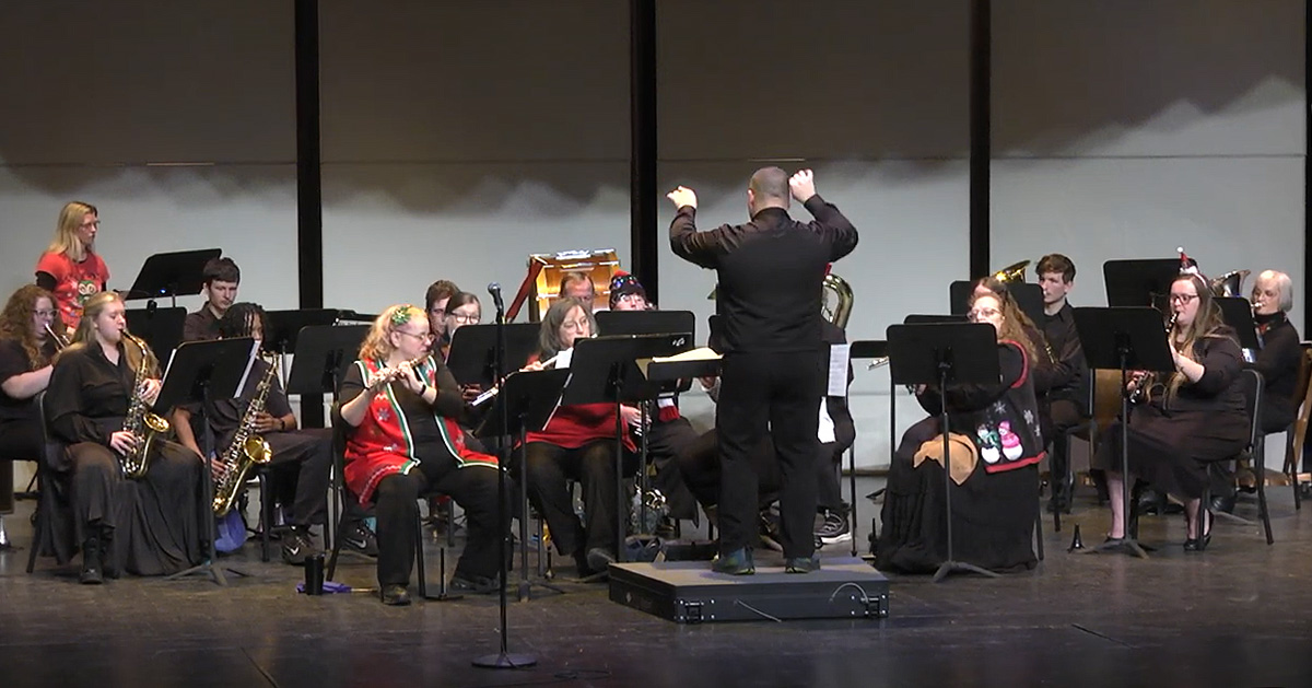 The KCC Concert Band performs onstage.