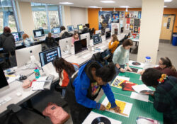 Graphic Design students work on projects during class in the Graphic Design Lab.