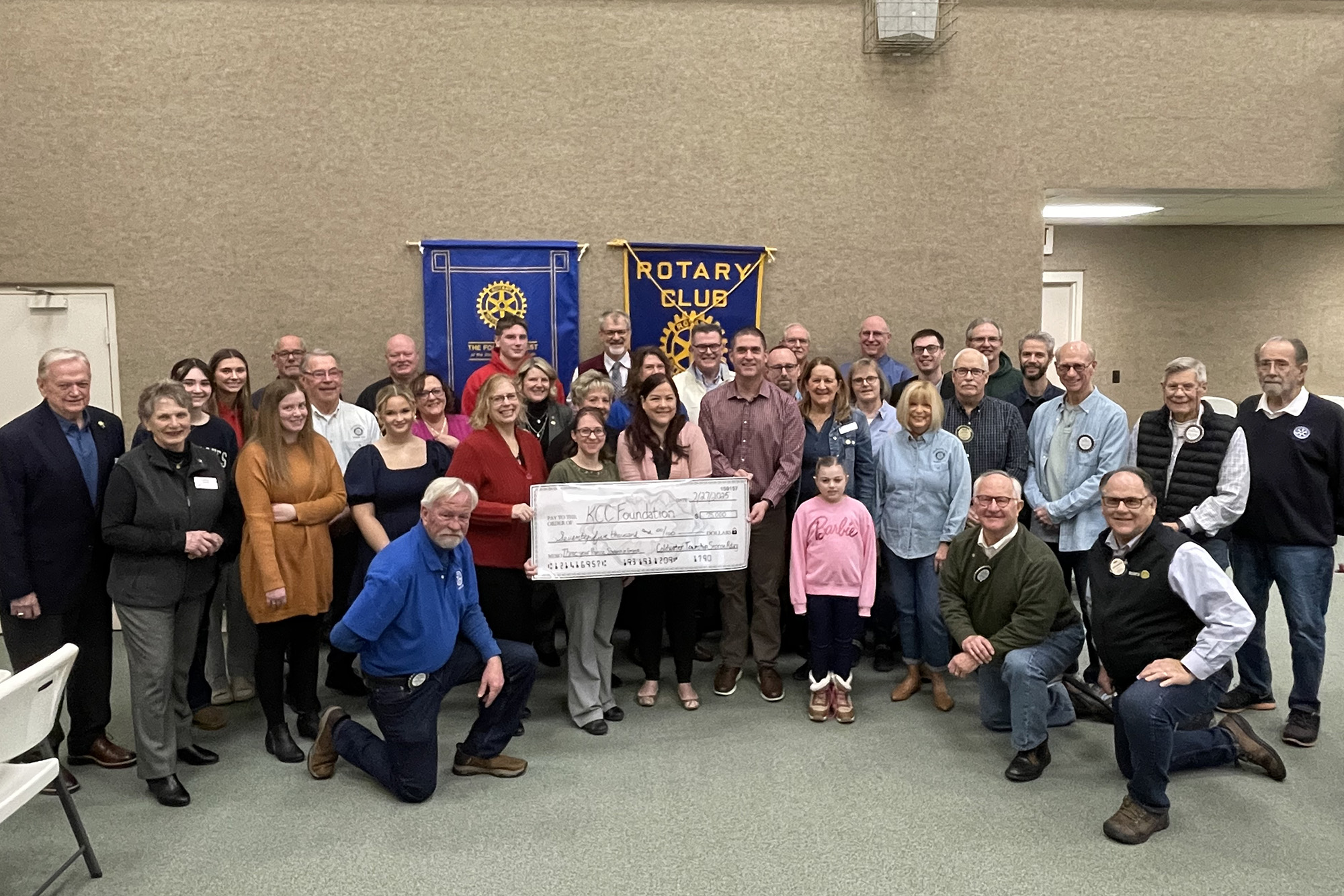 The Coldwater Township Sunrise Rotary Club poses with scholarship recipients and college officials.