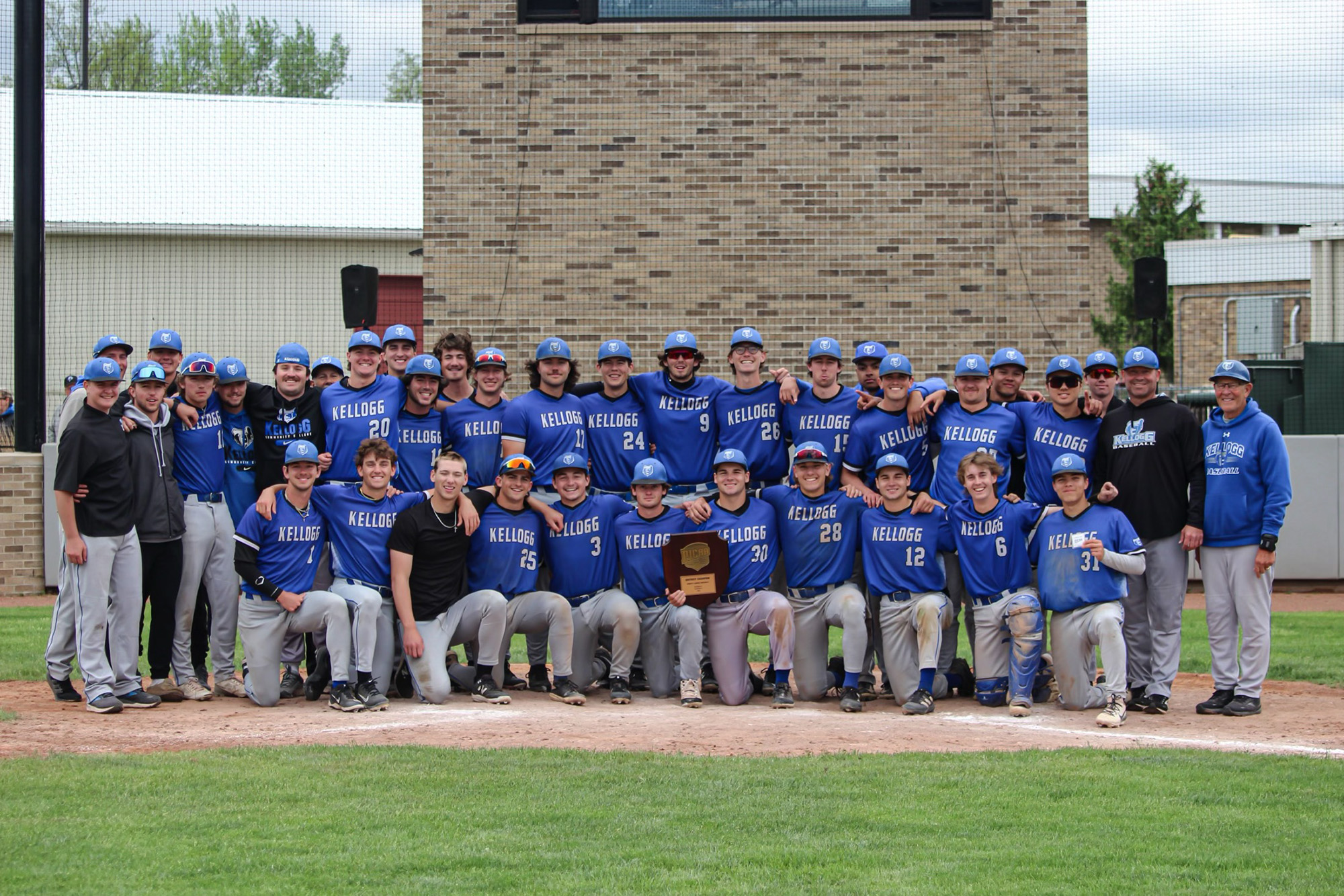 The KCC baseball team poses with the team's championship plaque after winning regionals. Photo by Allie Dietzel.