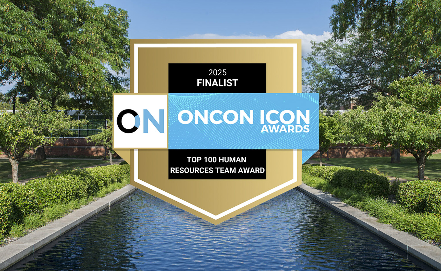The OnCon Icon Awards logo superimposed over an image of KCC's campus looking over the reflecting pools.