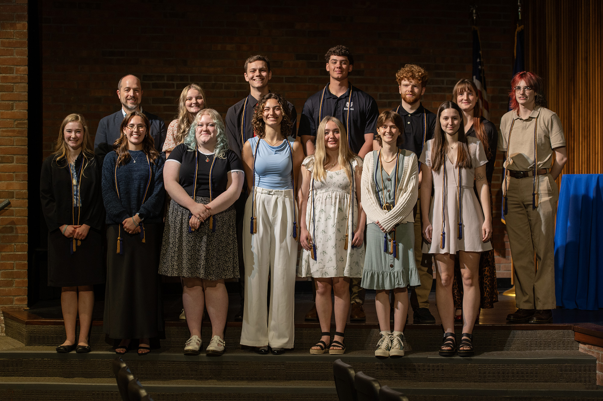 Presenting Honors Symposium students pose for a group photo with KCC English Professor and Honors Program Faculty Steward Matt Samra (back far left) after their presentations in KCC’s Binda Performing Arts Center on campus in May.
