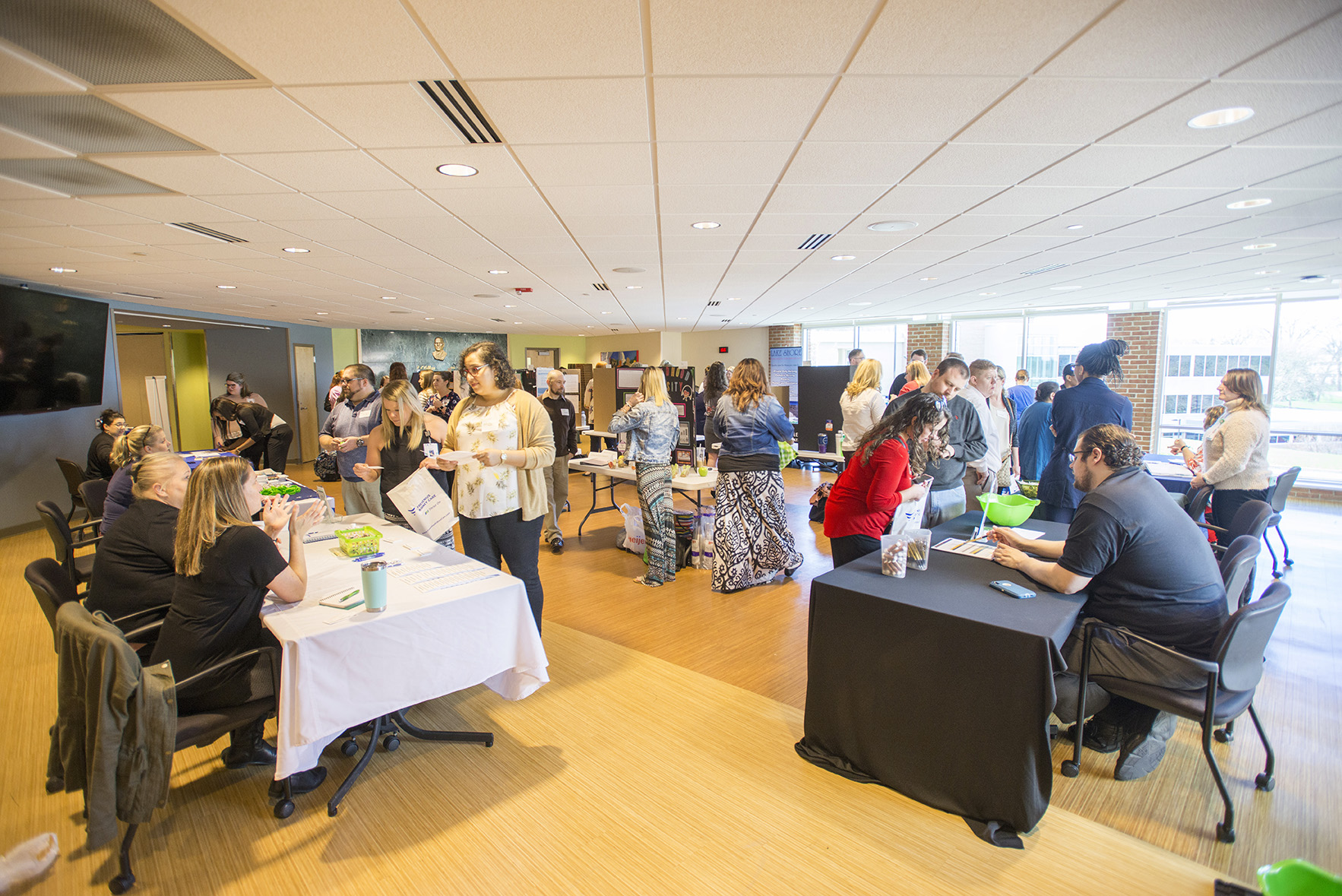 Vendors and attendees mingle at a special event on campus.