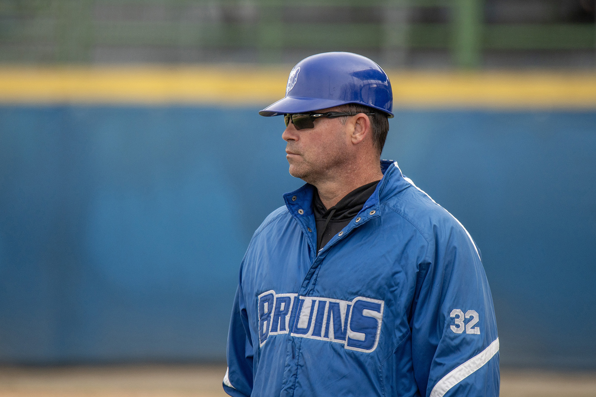 Coach Laskovy coaches during a home baseball game.