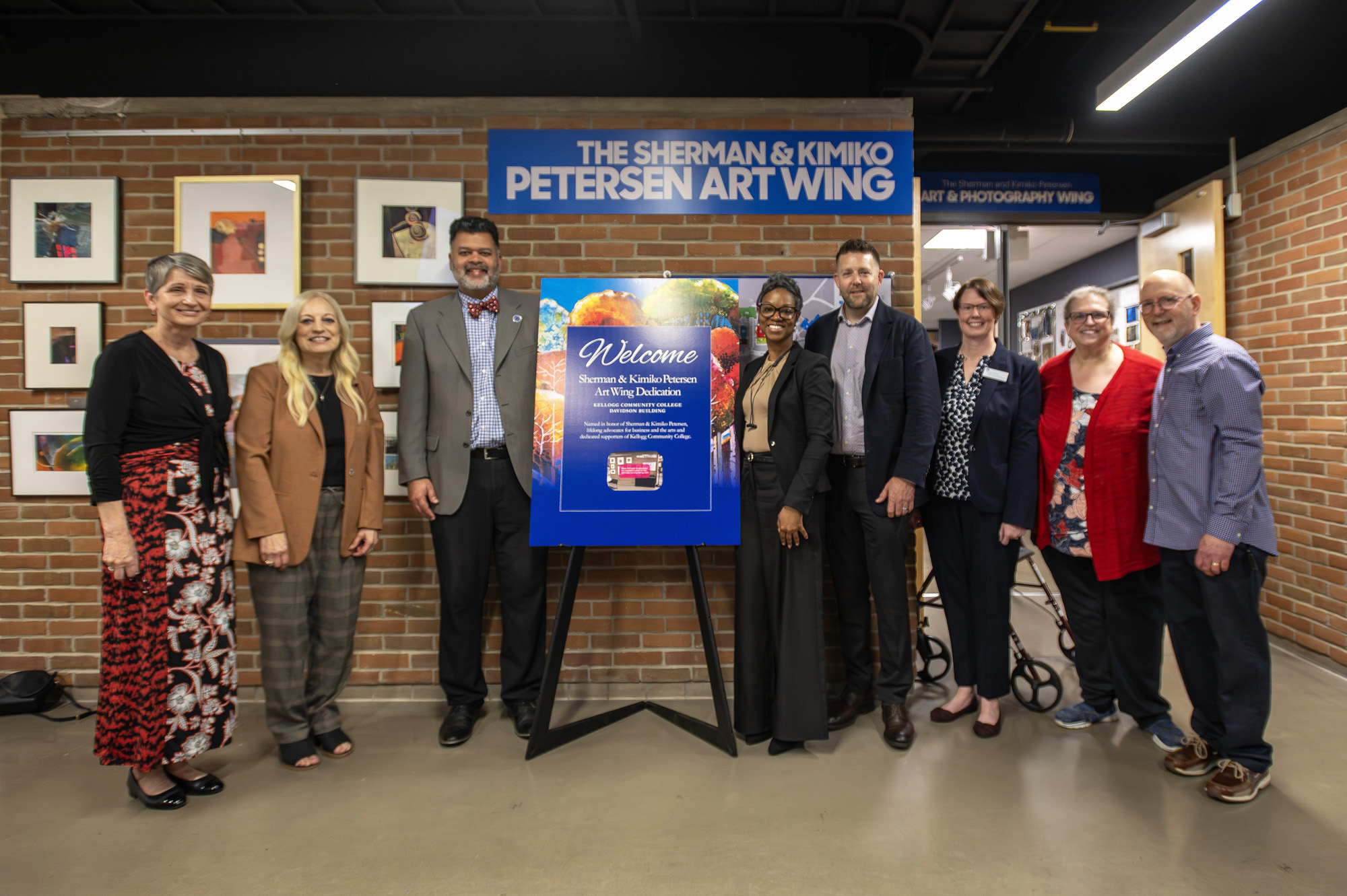 Pictured outside the newly named Sherman & Kimiko Petersen Art Wing at Kellogg Community College, from left to right, are retired KCC Foundation Executive Director Teresa Durham; KCC Trustee Lisa Mueller; KCC President Dr. Paul Watson; KCC Business and Information Technology Director Sheenita Davis; KCC Foundation Board Chair Drew Schweitzer; KCC Foundation Executive Director Michelle Williamson; KCC Arts and Communication Chair Barbara Sudeikis; and retired KCC Art professor Pete Williams.