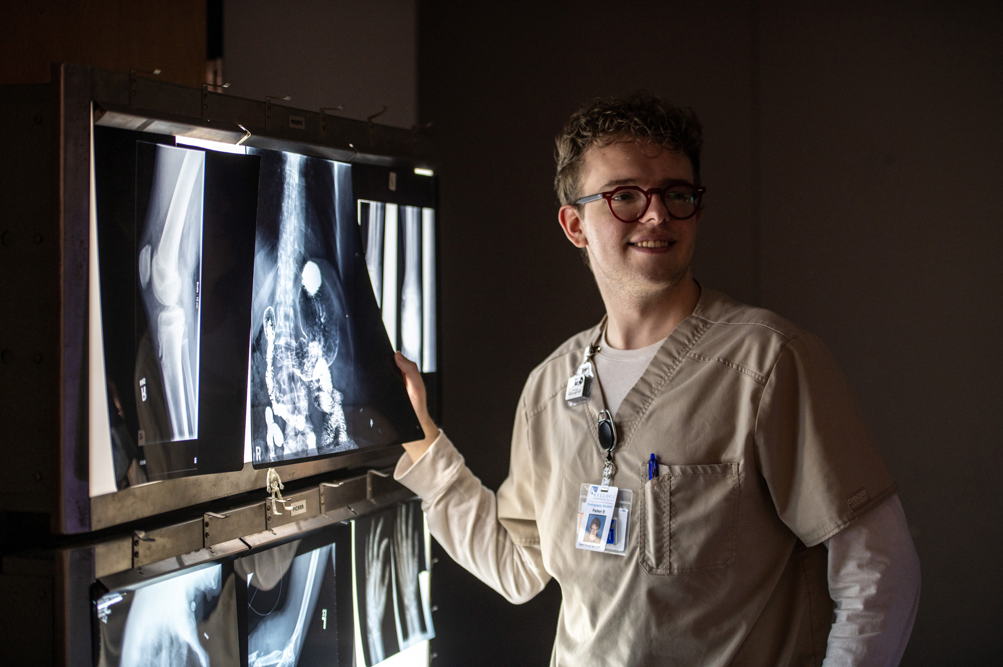 Radiography student Parker Blank looks at X-rays in a lab.