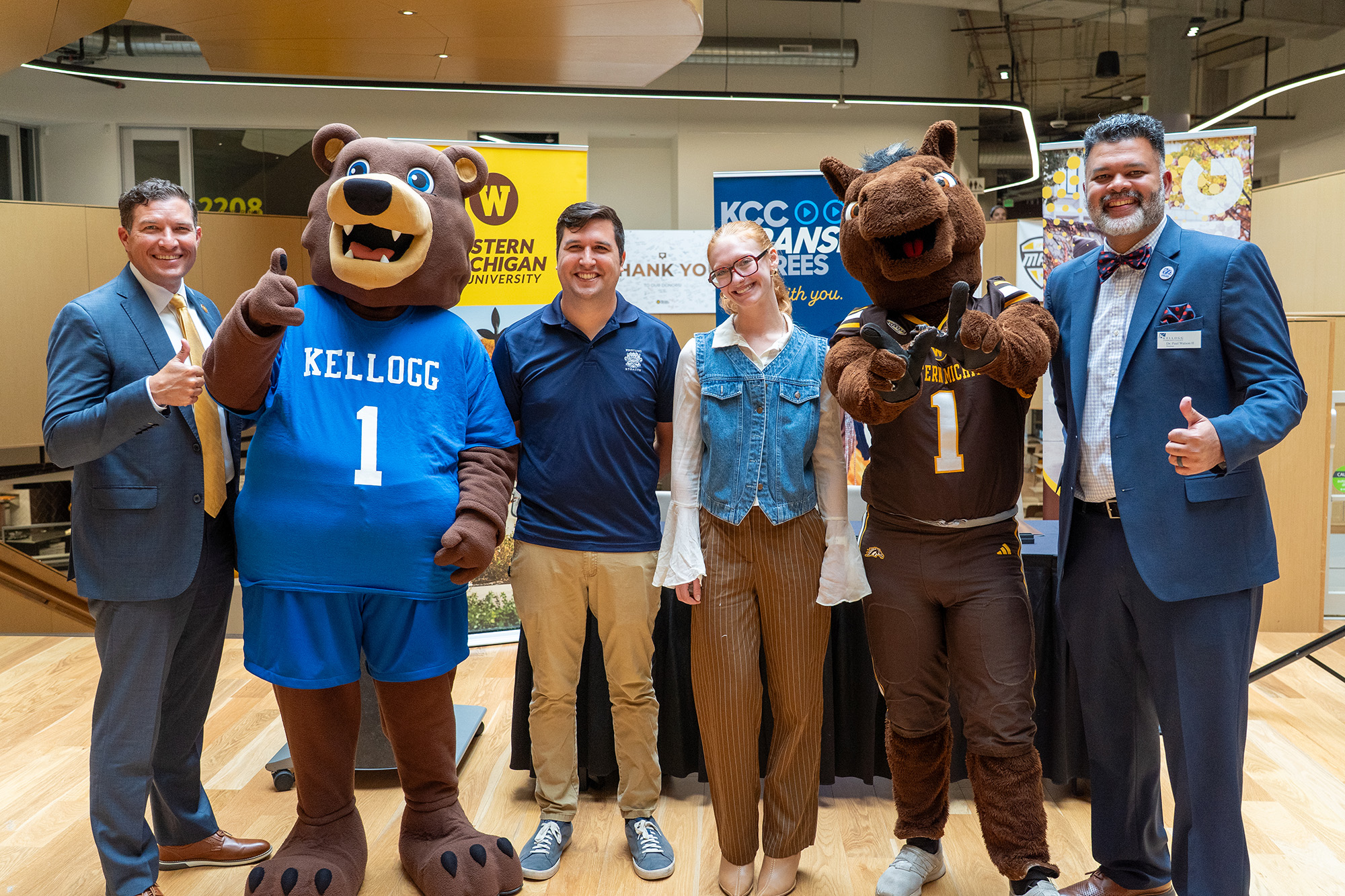 WMU President Russ Kavalhuna, KCC mascot Blaze, KCC-to-WMU students Chad Singleterry and Carleigh Hassing, WMU mascot Buster Bronco and KCC President Dr. Paul Watson II
