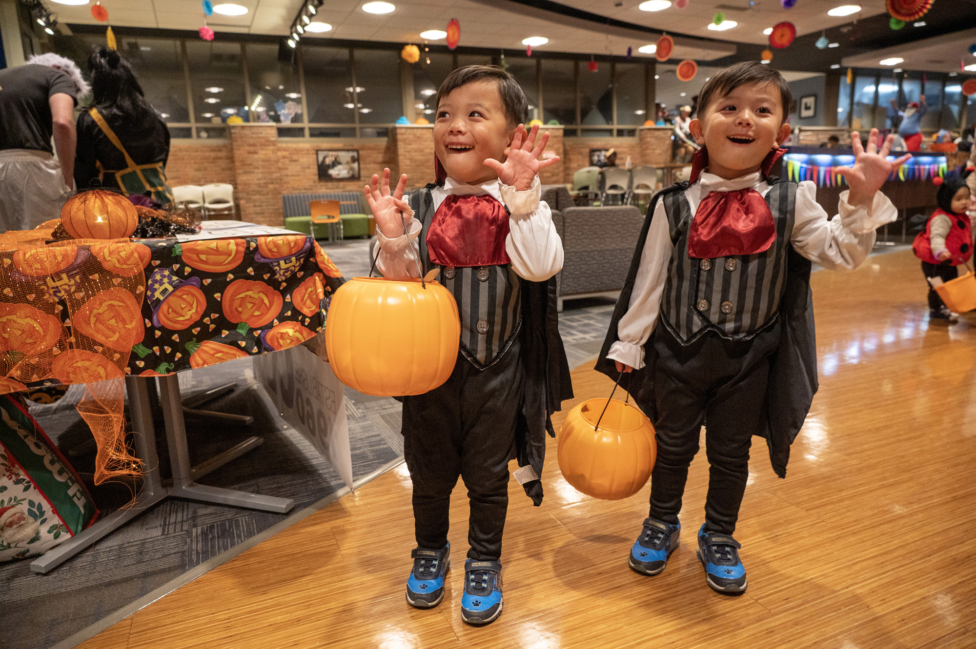 Two young kids dressed as vampires at Bruin Boo 2025.