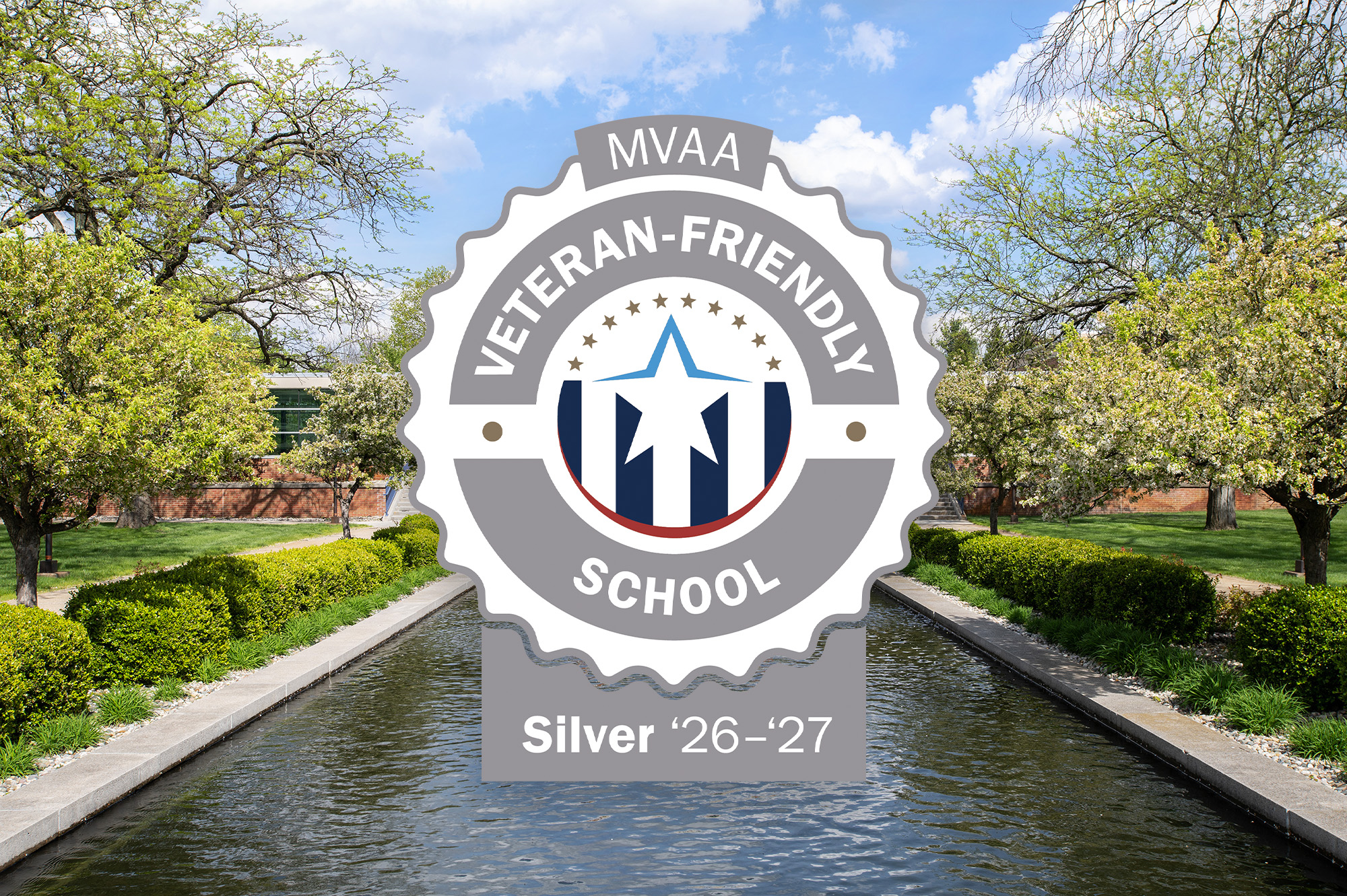 The MVAA Veteran-Friendly School: Silver 26-27 emblem logo superimposed over a photo of KCC’s campus.